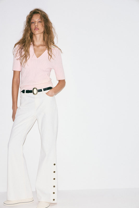 FLARED JEANS WITH BUTTONED SLITS