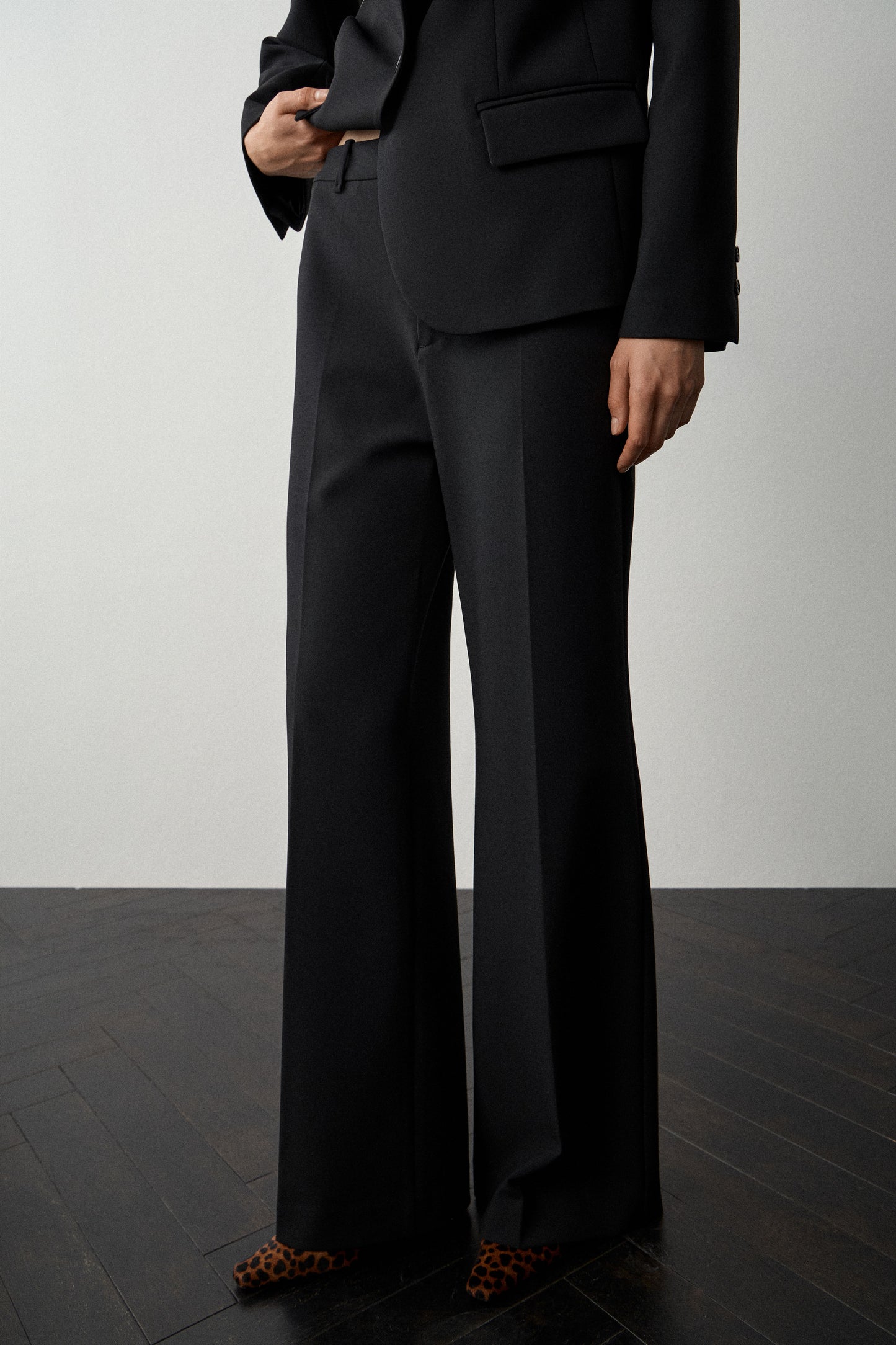 CREASED FLARE TROUSERS